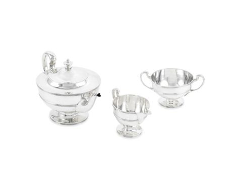 A Scottish three-piece silver tea serviceJohn Alexander Fetter, Glasgow 1923 Each of circular outline, with reeded rims and g