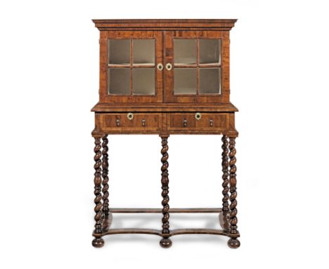 A yew wood cabinet on standbasically William and Mary period with some later elementsWith a pair of astragal glazed panelled 