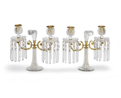 A pair of Victorian gilt brass and cut glass twin light 'Prince of Wales feather' lustre candelabrathe foliate gilt scrolling