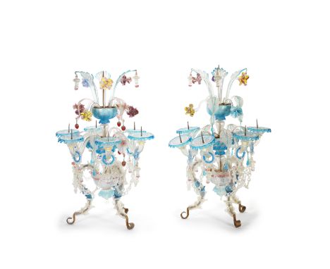 Two similar early 20th century Murano coloured glass three light table candelabrathe scrolling candle arms with scalloped col