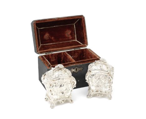 A cased pair of George III silver tea caddiesJohn Wakefield, London 1818 In mid-18th century style, with rich rococo scroll d
