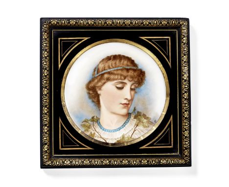 A late 19th century framed porcelain platein the aesthetic taste,the plated enamelled with a portrait of a classical youth, h