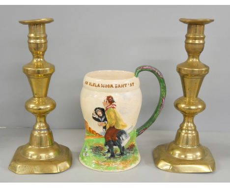 A pair of 19th century brass candlesticks and a Crown Devon musical jug 