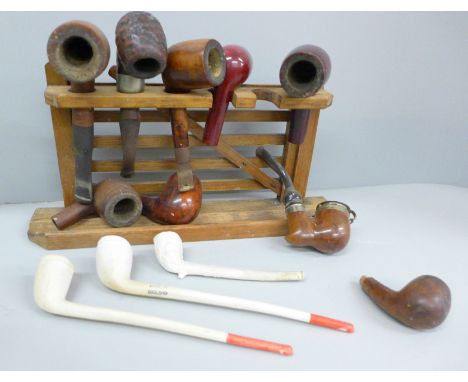 A collection of pipes and a pipe rack 