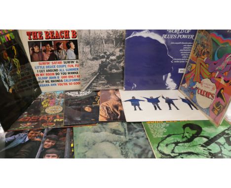 A collection of sixteen LP records, original 1960s pressings including The Beatles, Jimi Hendrix, The Who, etc.