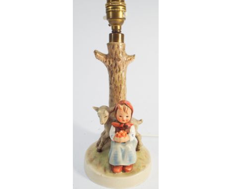 A collectable Hummel table lamp with seated girl and kid beneath a tree trunk height including  light fitting 26cms no obviou