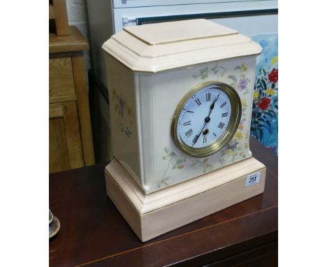 Mantle clock in floral decorated and pale pink china case, standing approx 11" high 