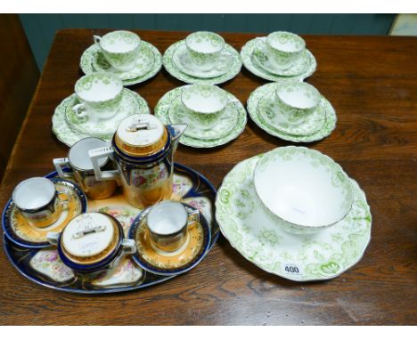 Part green patterned tea set and a part floral decorated early morning coffee service 