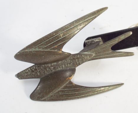 Vintage Art Deco car mascot modeled as a flying Swift stamped copyright beneath 