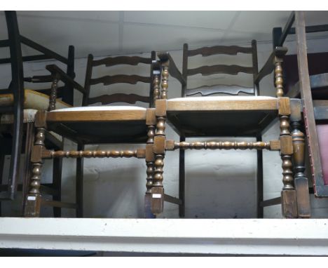 A pair of oak ladder back carver chairs  on bobbin turned legs