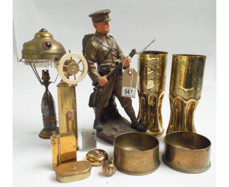 A collection of various items of trench art and other related military items to include cigarette lighters, snuff box a lamp 