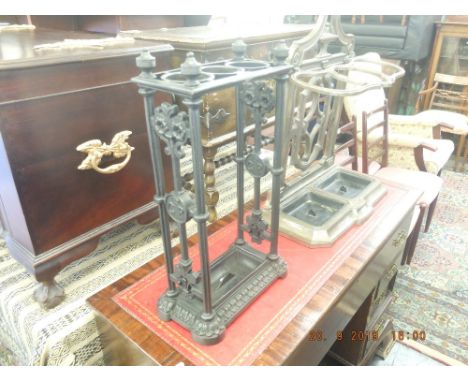 A cast iron stick stand marked GR