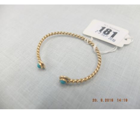 A yellow metal and turquoise bangle bracelet marked 18k weight 9 grams