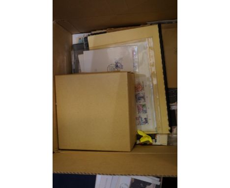 A box containing stamps in packets on album sheets on Hagners plus some commonwealth First Day Covers etc