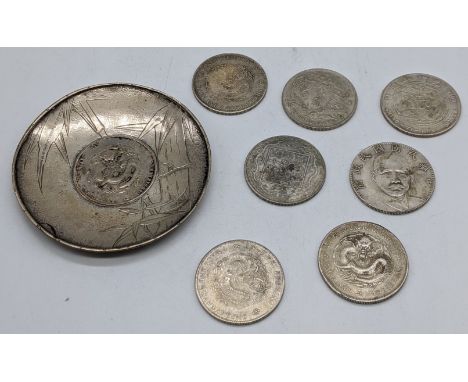 A Chinese silver coin dish together with 7 Chinese coins