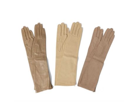 Three pairs of evening gloves The first pair cotton, by Dior, in original sleeve, unworn; the second pair leather, by A. Manc