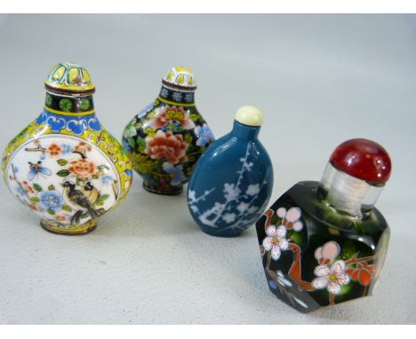 Group of four snuff bottles. Two with red character marks decorated with hand painted enamel over metal. Along with a celadon