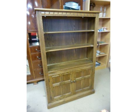 Darkwood Ercol bookcase with cupboard under