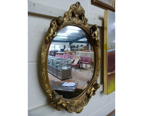 Vintage style gilt framed mirror decorated with putti