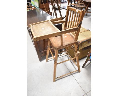 A vintage childs high/low chair, with wooden wheel attachment