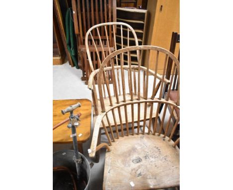 A pair of stripped windsor style hoop and stick back carver chair.
Condition report: Damage to one arm, slight loose spindles