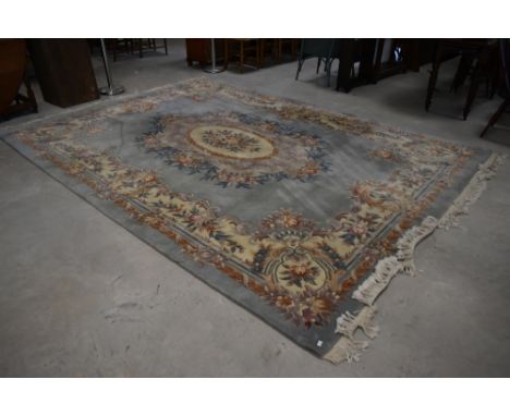 A large traditional Chinese carpet square, having light blue ground with floral patterns , approx. 366 x 274cm (12 x 9 feet) 