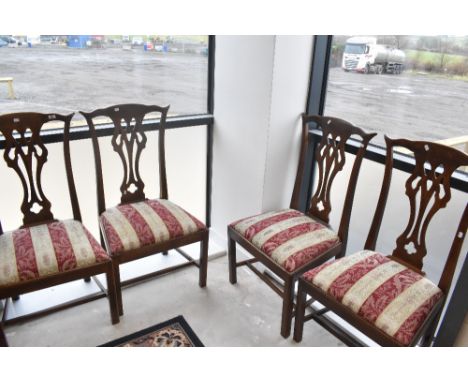 A set of four Georgian mahogany Chippendale style dining chairs having later Biedermeir stripe style upholstered drop in seat