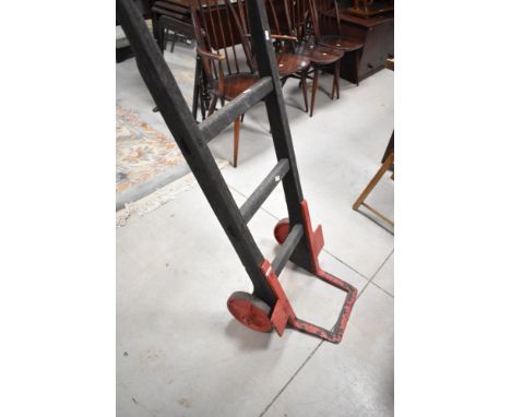 A vintage wooden sack bogey , with cast wheels and supports, possibly Railway related