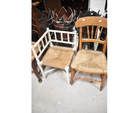 A 19th Century corner chair having painted bobbin frame and a spindle back kitchen chair having rush seat