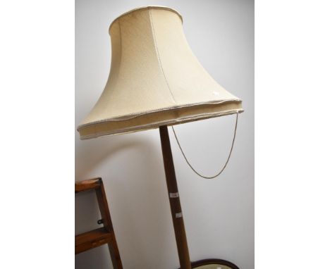 A traditional standard lamp having turned column and base