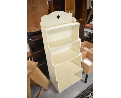 A vintage painted waterfall bookshelf of small proportions, height approx. 113cm, width 46cm
