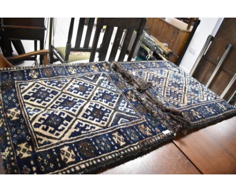 A traditional Afghan woollen carpet saddle bag of large proportions, open size approx. 135 x 70cm