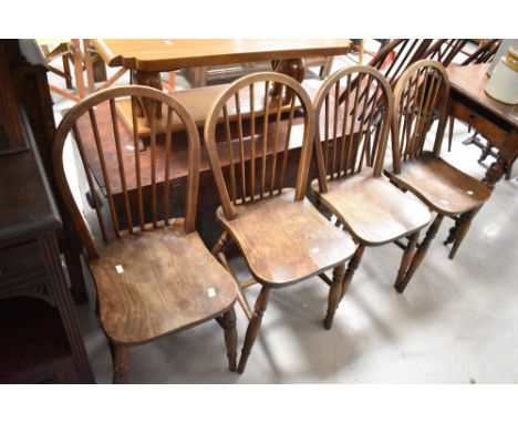 A set of four traditional elm hoop and stick back kitchen chairs