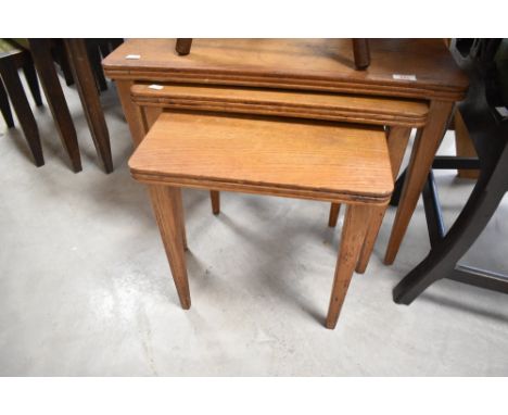 A Gordon Russell designed vintage nest of three tables, overall width approx. 62cm, bearing label for Russell of Broadway tog