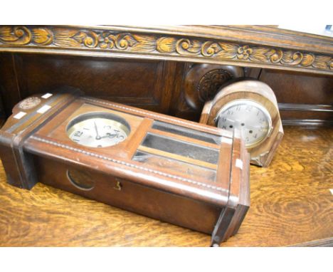 An early to mid 20th Century mahogany cased wall clock and a similar mantel clock case (movement loose inside)