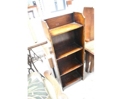 An early 20th Century oak narrow shelf, labelled on reverse for 'Homettes' , dimensions approx. H92 W33 D17cm