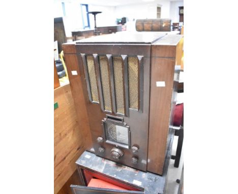 A vintage Pye valve radio, having open back , with bakelite controls