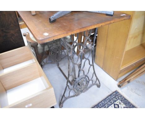 A vintage sewing machine table with later top, approx. 82 x 59cm