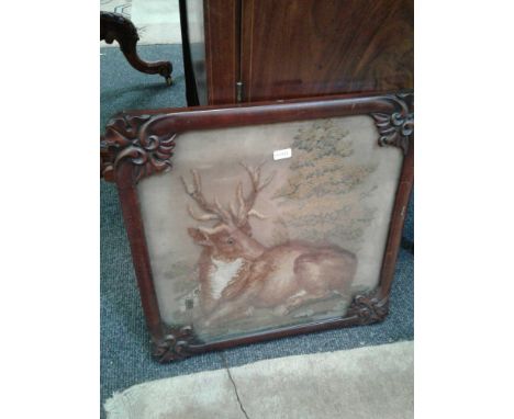 the needlework panel mounted in a mahogany Rococo frame, without pole