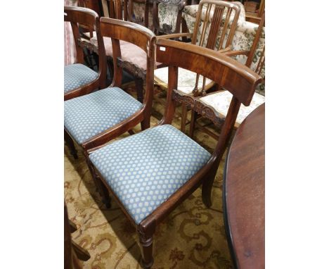 the shaped backs with carved splats, drop in seats and panel legs