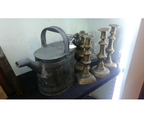 the shaped body mounted with a carry handle and spout, together with a lamp, candlestick and other wares