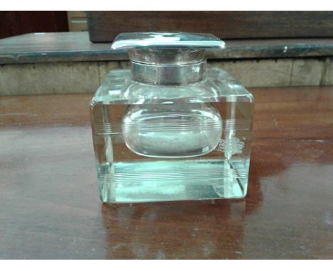 the cut glass inkwell, mounted with a London silver tilt top