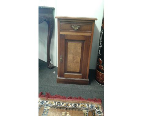 of rectangular form, the single drawer above a cupboard door on a plinth base