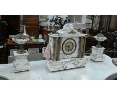 comprising of a Neo Classical mantle clock and two garnitures