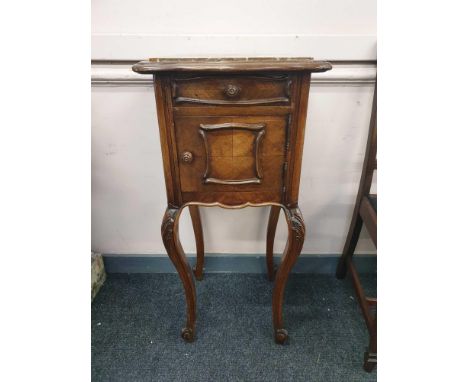 the shaped marble top above a single drawer and cupboard door raised on carved cabriole legs