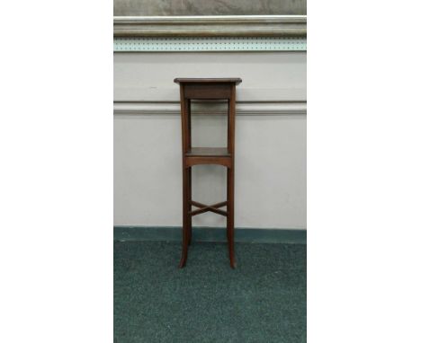 of square form, the moulded&nbsp;top resting on a plain frieze supported by four tapering legs with square shelf and x-frame 