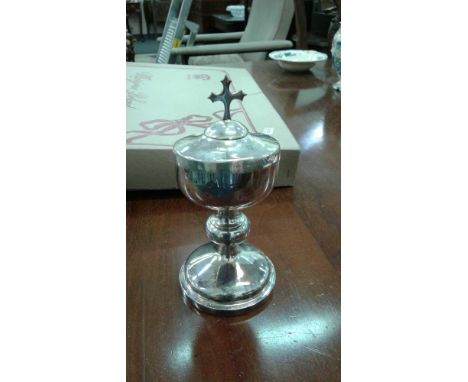 the lid with crucifix finial and a gilt interior