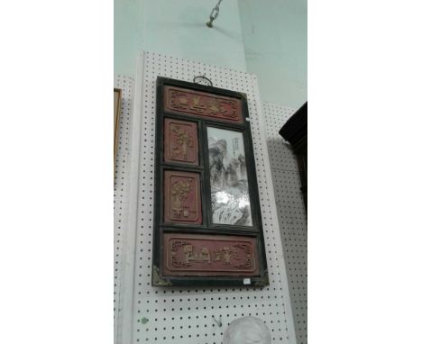 the porcelain panel contained within a lacquered frame in relief