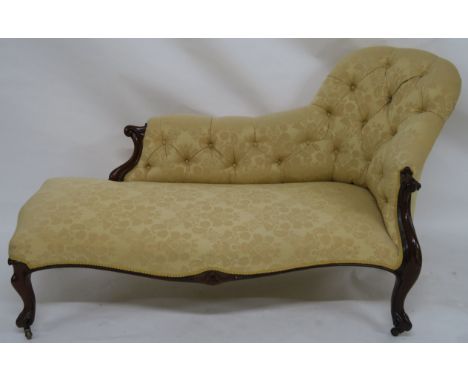 A VICTORIAN WALNUT CHAISE LOUNGE with three quarter scroll button back above a shaped seat and on scroll legs, 97cm high, 180