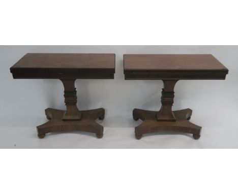 A PAIR OF VICTORIAN MAHOGANY TEA TABLES the hinged tops with gadroon rims on square tapering columns divided by acanthus leaf